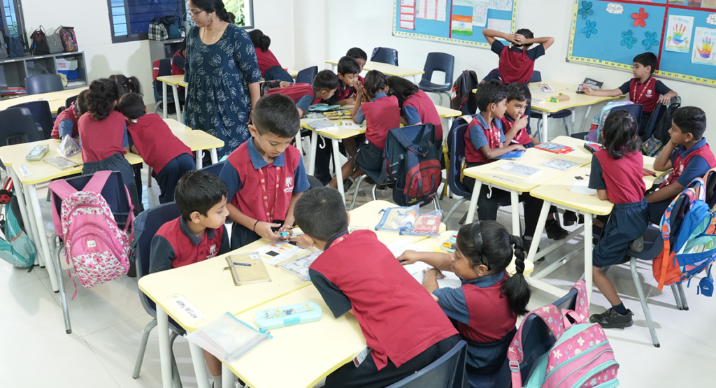 Students writing a classroom test at Vidyashilp School, Banashankari.